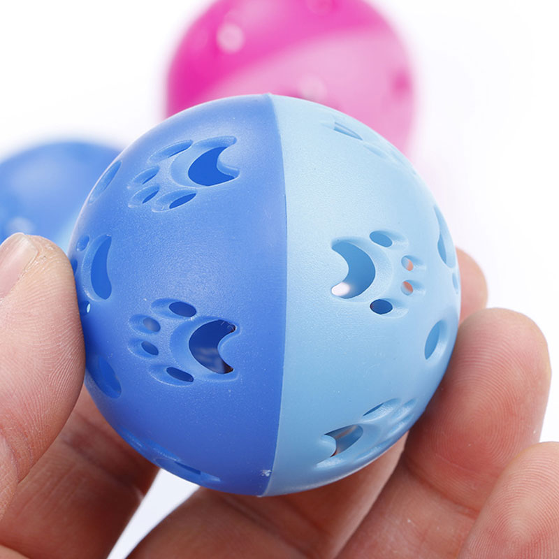 Close-up of blue hollow paw print cat ball toy