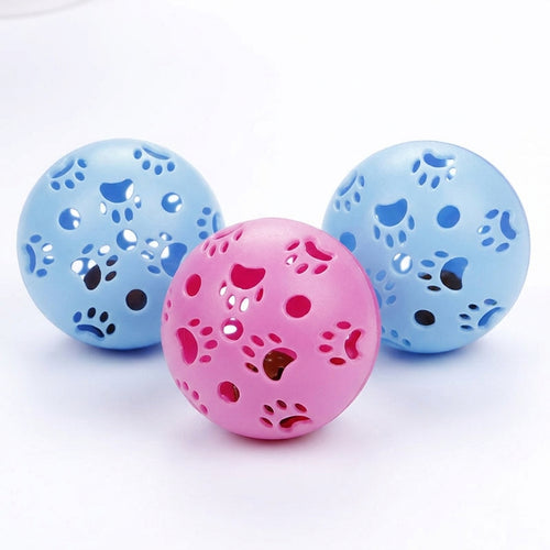 Blue and pink hollow paw print balls for interactive cat play