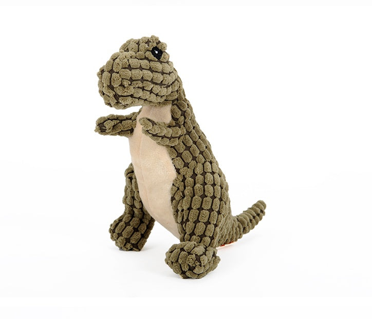 Green dinosaur plush dog toy with textured body and cream belly