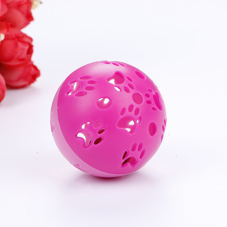 Pink hollow paw print ball toy for cats